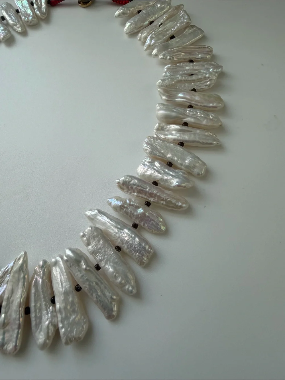 NWOT Roxanne Assoulin White Pearl Spike and Gold Charm Layered Necklace